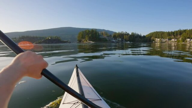 Kayaking in Indian Arm near Belcarra, Vancouver, BC, Canada. Sunny Sunset. Adventure Travel Concept