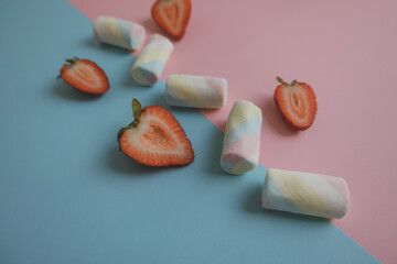 Colorful marshmallows background and strawberry.Top view. 