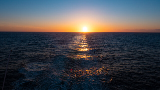 image of sunset at sea. sunset at sea nature. sunset at sea seascape. beautiful sunset at sea water © be free