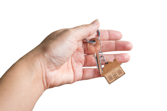 Hand holding the key with a house keychain. Isolated, transparent background.