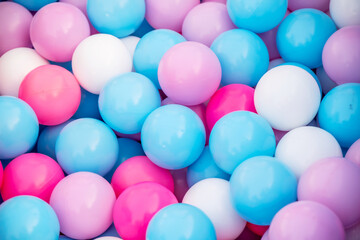 Background image, plastic balls of different colors, multi-colored balls on the playground or the children's game room