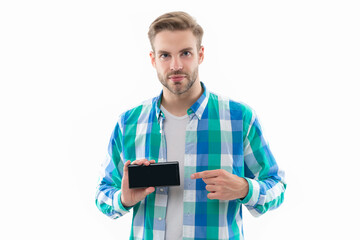 man with phone screen isolated on white, point finger. man shows phone screen in studio.