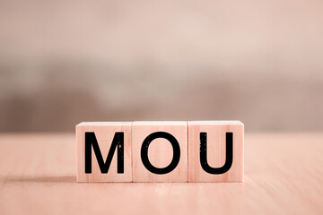 MOU - memorandum of understanding business concept. A nonbinding agreement that states each party's intentions to take action, conduct a business transaction, form a new partnership. Smart