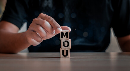 MOU - memorandum of understanding business concept. A nonbinding agreement that states each party's...
