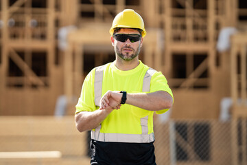 Hispanic man construction worker in helmet at building. Construction building. Construction site...