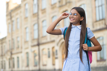 Fototapeta premium photo of teenage school girl look far, copy space. teenage school brunette girl.