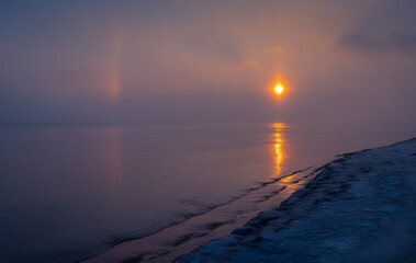 sunrise over the sea with rainbows - 605532597