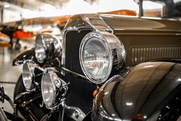 Four round headlights on the front of a retro old vintage car