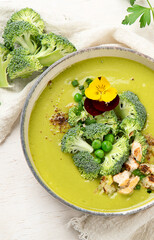 Green soup. Broccoli cream soup. Healthy vegan dish. Top view