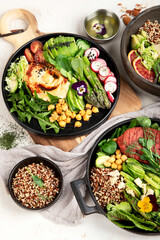 Healthy vegetarian and vegan  salads and Buddha Bowls with vitamins, antioxidants, protein on light  background.