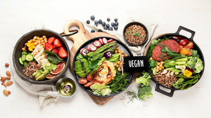 Healthy vegetarian and vegan  salads and Buddha Bowls with vitamins, antioxidants, protein on light  background.