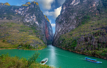The alley of the Nho Que river. A famous river located in Ha Giang Vietnam is jade green	