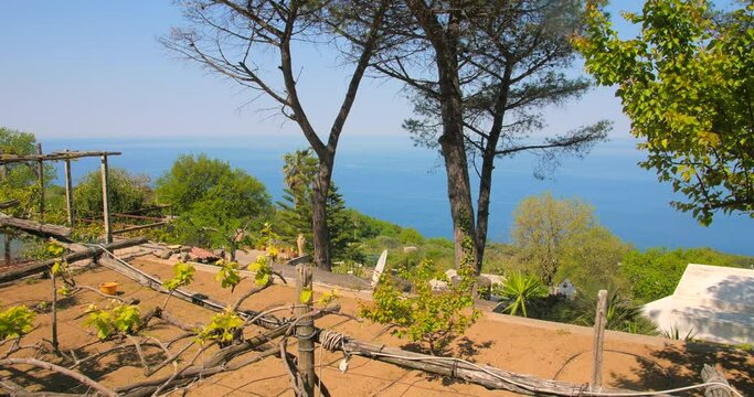 Sunny Garden Overlooking Seascape In Capri Island, Campania, Southern Italy. Pan Right