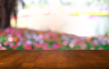 Empty dark wooden table in front of abstract blurred bokeh background of restaurant . can be used for display or montage your products.Mock up for space.