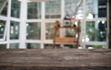 Empty dark wooden table in front of abstract blurred bokeh background of restaurant . can be used for display or montage your products.Mock up for space.