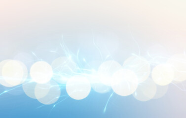 Abstract background of light blue shades with glare and bokeh effect.