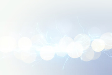 Abstract background of light blue shades with glare and bokeh effect.