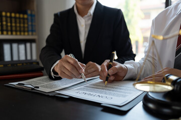 Businessmen and lawyers discuss and explain the contract documents Legal treaty before the signing of a business contract.