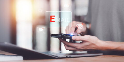 Businessman checking electronic mail ,Email marketing and newsletter concept ,Digital communication with email messages ,Sending and receiving messages online with the email icon ,Newsletter