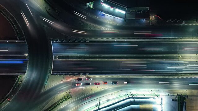 Expressway top view, Road traffic an important infrastructure, car traffic transportation above intersection road in city night, aerial view cityscape of advanced innovation, financial technology	