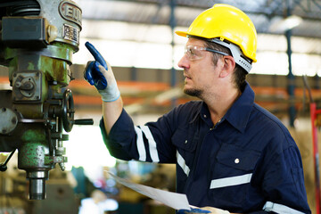 Professional caucasian white ethnicity male technician operating the heavy duty machine in the...