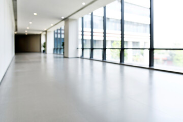 Abstract defocused blurred background of empty long corridor in the modern hospital