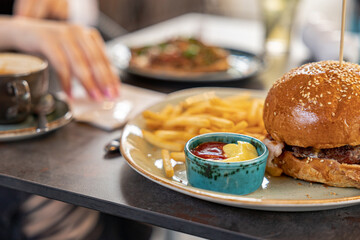 tasty delicious home made burgers with french fries