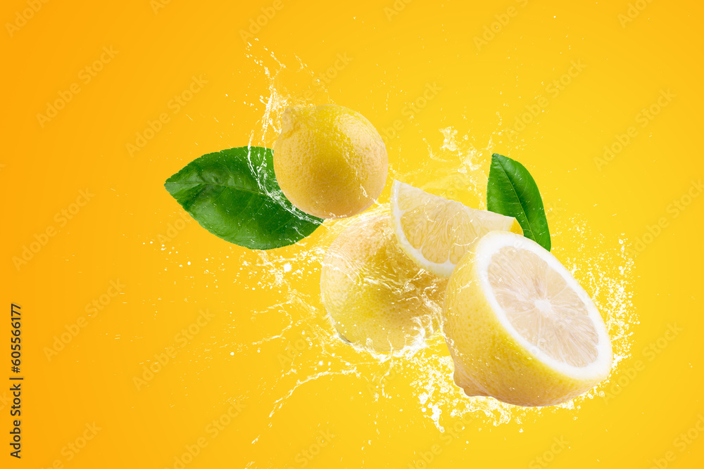 Wall mural Creative layout made from Fresh Sliced lemon fruit and water Splashing on a green background. - Wall murals