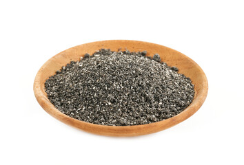 black sesame powder isolated in wood plate on white background. pile of black sesame powder...