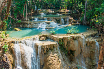 Huay Mae Kamin waterfall with blue and clear water in Kanchanaburi Thailand 