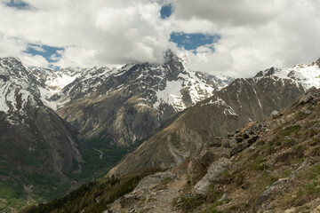 Hiking in the Ecrins massif under the Cime de la Condamine in the French Alps