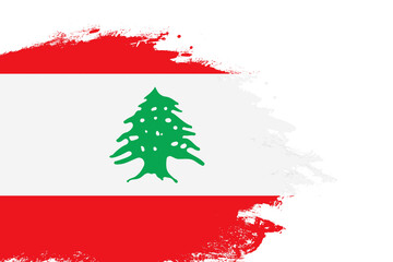 Lebanon flag on a stained stroke brush painted isolated white background with copy space
