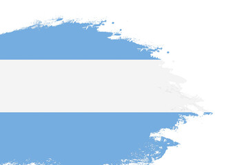 Fototapeta premium Argentina flag on a stained stroke brush painted isolated white background with copy space