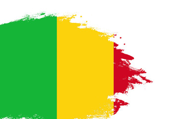 Mali flag on a stained stroke brush painted isolated white background with copy space