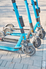 Electric Scooters For Public Use, Standing On The Street In The City Center. Public mobile transport. urban eco-friendly transport for rent