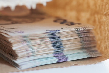Ukrainian hryvnia banknotes in paper bag. Concept of illegal payment, bribery, corruption