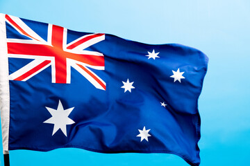 Australia flag waving on blue background