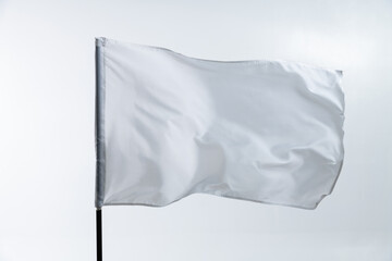 White flag waving on white background