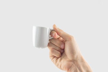 Holding a cup of espresso 
