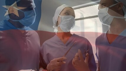 Animation of waving texas flag over team of diverse surgeons discussing together at hospital - Powered by Adobe