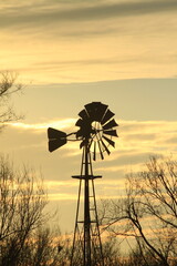  Kansas windmill at sunset with clouds
