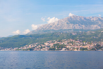 Fototapeta na wymiar Herceg Novi city in Montenegro at Kotor Bay . Coastal city in Balkans . Houses at the hill