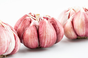 Fresh red skin garlic head on white background