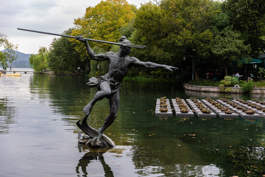 Hangzhou, China - October 15, 2020: Sculpture of Zhang Shun, one of 108 greenwood heroes in classic novel  Water Margin, at Yongjin Pond by West Lake or Xihu, killed below Yongjin Wate Gate in battle.