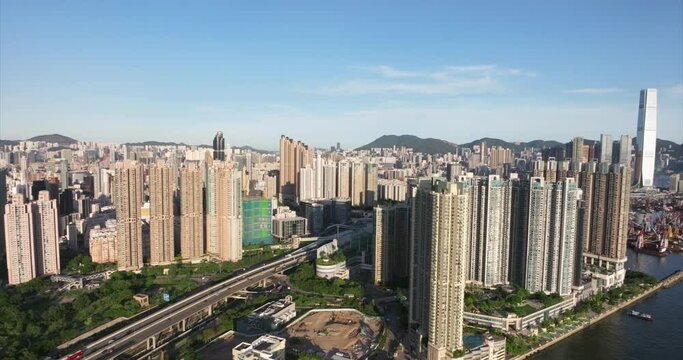 Modern condos in sunny Olympian, Kowloon, Hong Kong - Ascending aerial view