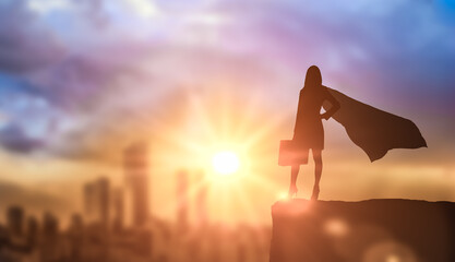 silhouette Brave woman confident superhero with cape. Ambition and business success concept. Leadership hero power, motivation and inner strength symbol - obrazy, fototapety, plakaty