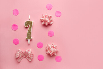 Number 7 on pastel pink background with festive decor. Happy birthday candles. The concept of celebrating a birthday, anniversary, important date, holiday. Copy space. Banner