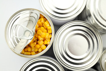 Canned food in blank metal jars, concept of canned food