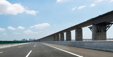 Fototapeta premium Empty bridge highway under blue sky
