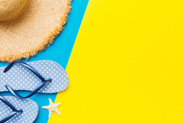 Summer vacation concept flat lay. straw hat beach accessories and flip flop top view. Space for text. travel concept